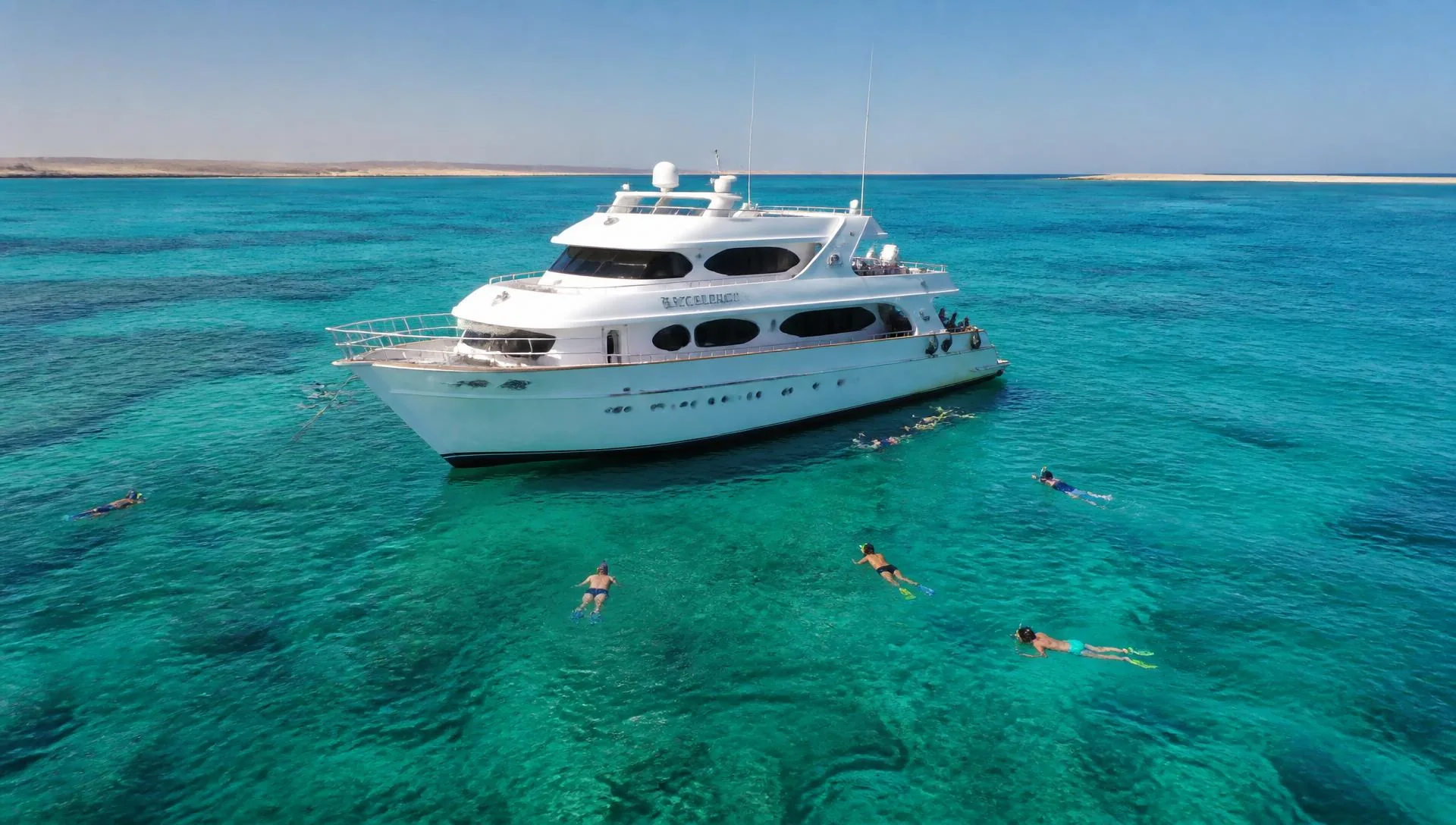 Luxury yacht with snorkelers in the turquoise Red Sea